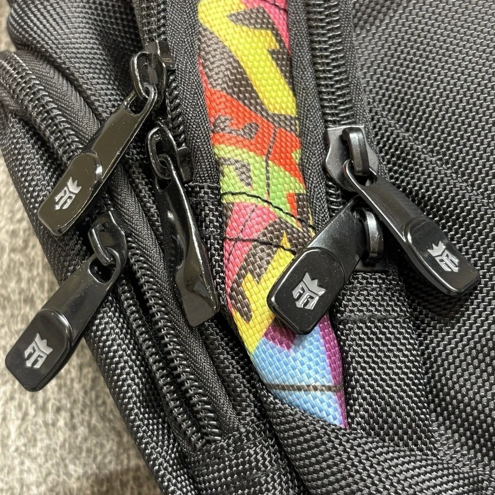 REIGN Total Body Fuel Backpack Black w/ Colorful Graffiti Accents‎ Multi Pocket